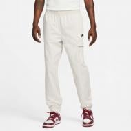 Брюки Nike M NSW SPU WVN PANT FD4336-072 р. S бежевый Брюки Nike M NSW SPU WVN PANT FD4336-072 р. S бежевый