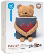 Іграшка розвивальна Taf Toys книжка-розкладушка 2-в-1 Обійми ведмедика 13795