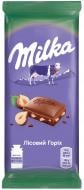 Молочний шоколад Milka молочний з подрібненим лісовим горіхом м/у 100г