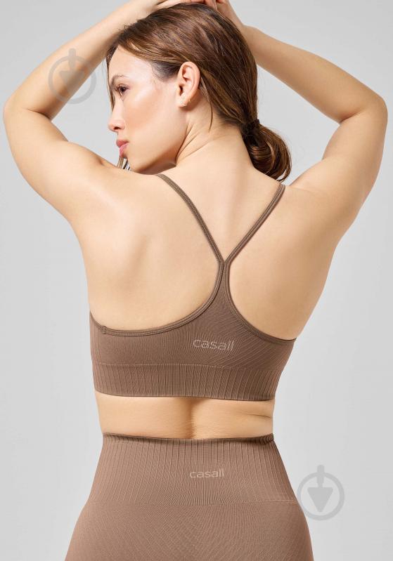 Бра Casall SEAMLESS GRAPHICAL RIB SPORTS TOP 22210-446 р.M коричневый - фото 4