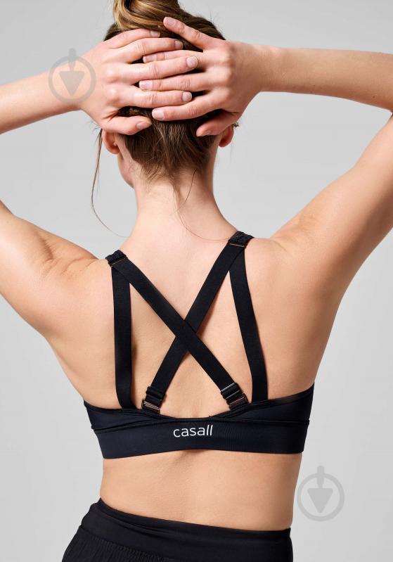 Бра жін.  р.M чорний 23120-901 MULTIFUNCTIONAL STRAPS SPORTS BRA BLACK,S Casall SS24 - фото 3