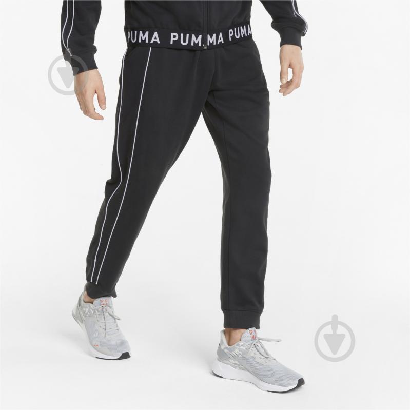 Брюки Puma TRAIN KNIT JOGGER 52183701 р. S черный - фото 1