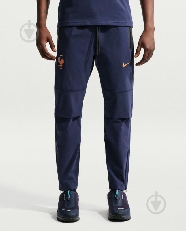 Штани Nike FFF M TECH WOVEN PANT IO0601-498 р. M блакитний - фото 1