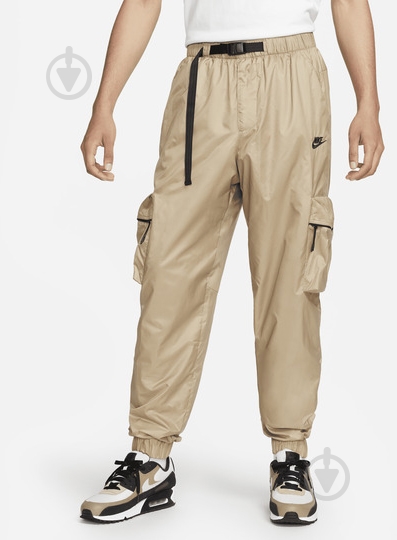 Брюки Nike M NK TCH WVN LND PANT FB7911-247 р. L бежевый - фото 1 Брюки Nike M NK TCH WVN LND PANT FB7911-247 р. L бежевый - фото 1