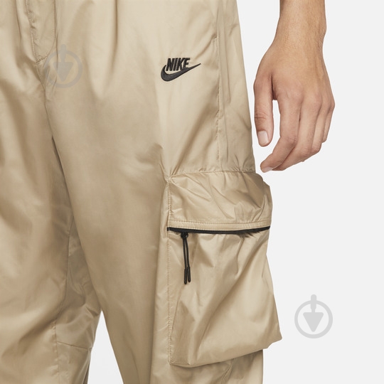Брюки Nike M NK TCH WVN LND PANT FB7911-247 р. L бежевый - фото 5 Брюки Nike M NK TCH WVN LND PANT FB7911-247 р. L бежевый - фото 5
