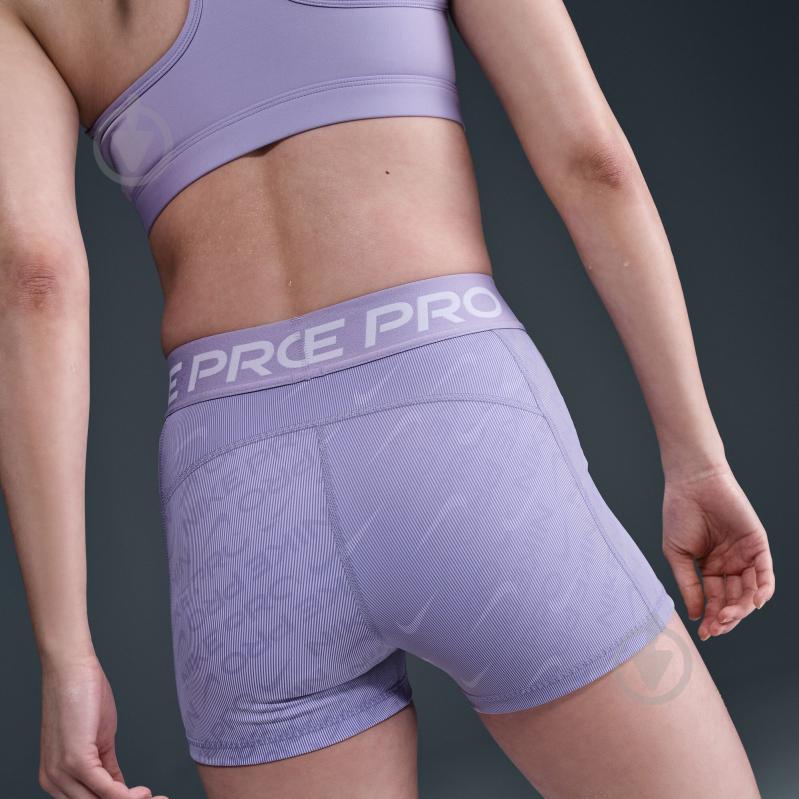 Лосини Nike W NP DF MR 3IN SHORT TT AOP HM6093-533 р.L фіолетовий - фото 10