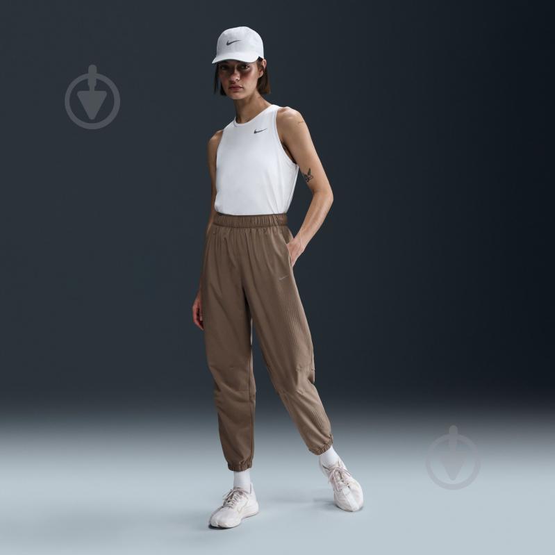 Штани Nike W NK FAST DF WRM MR 7/8 PNT FB7730-214 р. L коричневий - фото 8