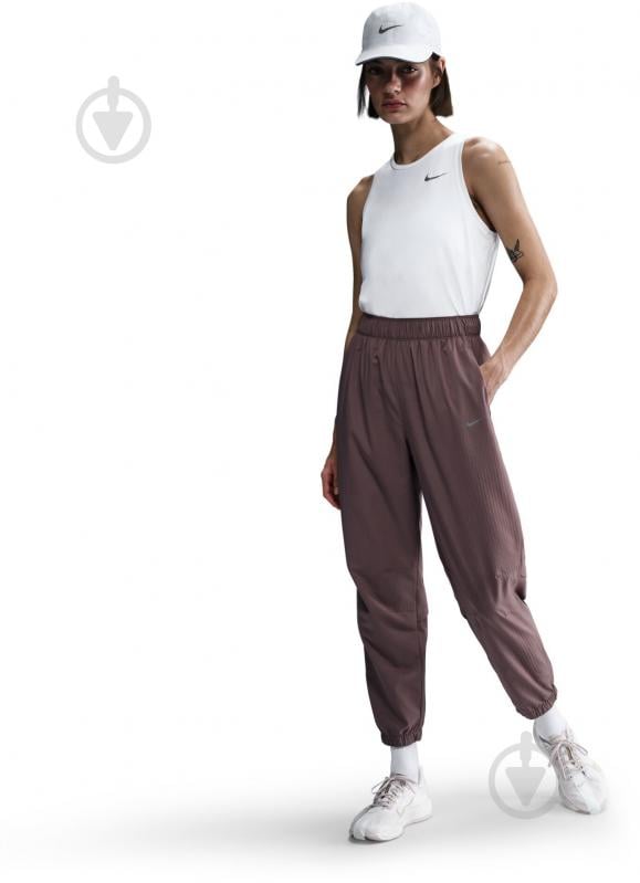 Штани Nike W NK FAST DF WRM MR 7/8 PNT FB7730-214 р. S коричневий - фото 2 Штани Nike W NK FAST DF WRM MR 7/8 PNT FB7730-214 р. S коричневий - фото 2
