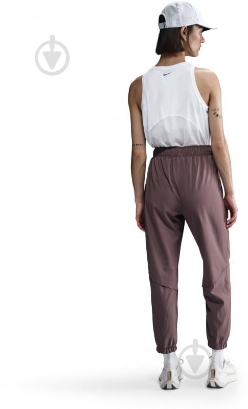 Штани Nike W NK FAST DF WRM MR 7/8 PNT FB7730-214 р. S коричневий - фото 3 Штани Nike W NK FAST DF WRM MR 7/8 PNT FB7730-214 р. S коричневий - фото 3