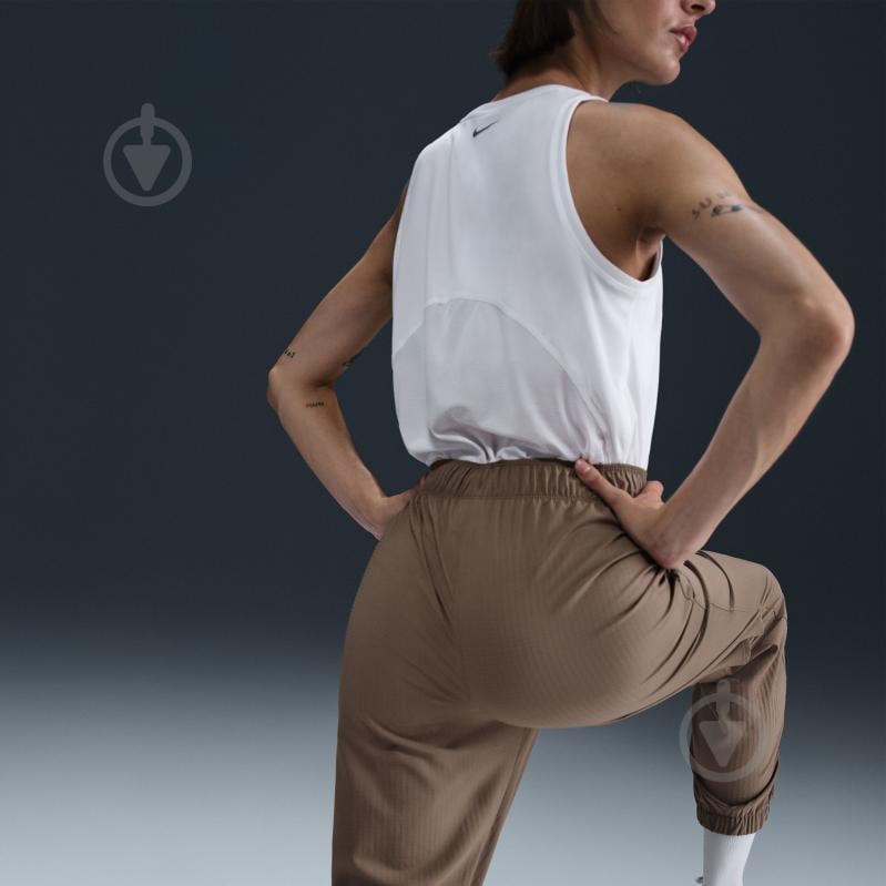 Штани Nike W NK FAST DF WRM MR 7/8 PNT FB7730-214 р. XL коричневий - фото 11