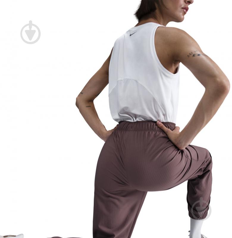 Штани Nike W NK FAST DF WRM MR 7/8 PNT FB7730-214 р. XS коричневий - фото 5