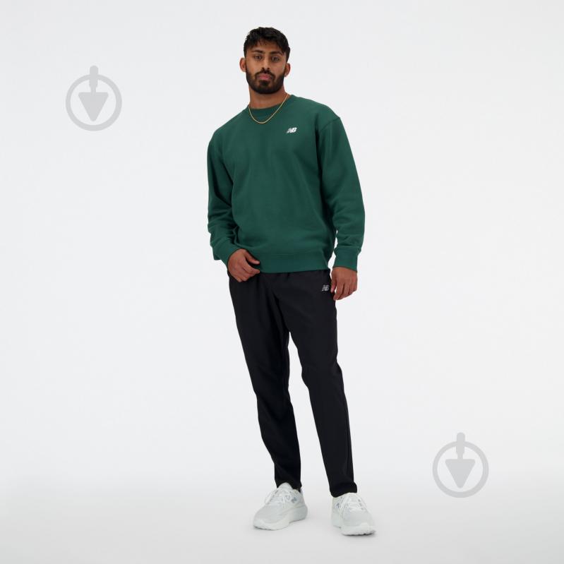 Штани New Balance AC STRETCH WOVEN TAPERED PANT MP41060BK р. S чорний - фото 1