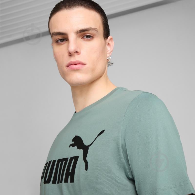 Футболка Puma ESS No. 1 Logo Tee (s) 68253330 р.S зеленый - фото 4 Футболка Puma ESS No. 1 Logo Tee (s) 68253330 р.S зеленый - фото 4