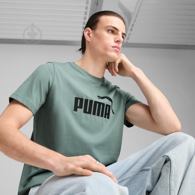 Футболка Puma ESS No. 1 Logo Tee (s) 68253330 р.S зеленый - фото 7 Футболка Puma ESS No. 1 Logo Tee (s) 68253330 р.S зеленый - фото 7