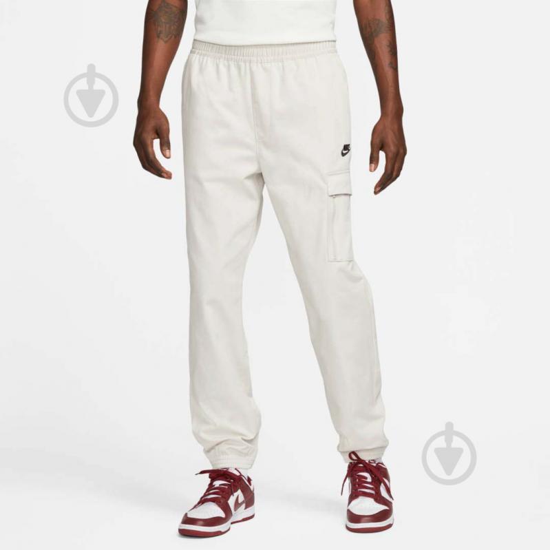 Штани Nike M NSW SPU WVN PANT FD4336-072 р. L бежевий - фото 1