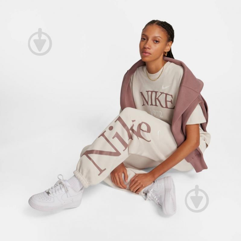 Штани Nike W NSW PHNX FLC OS LOGO SWTPNT FN2552-104 р. L бежевий - фото 3