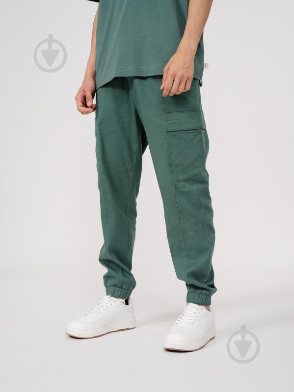 Брюки Outhorn TROUSERS CAS M198 OTHSS23TTROM198-44S р. S зеленый - фото 2