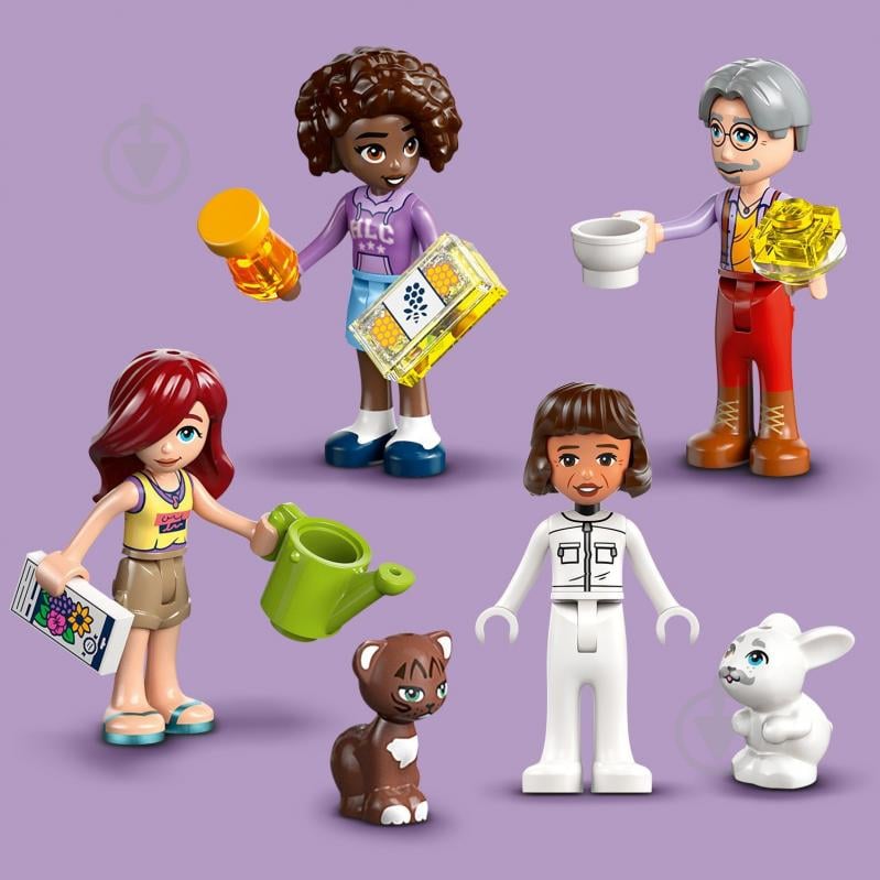 Конструктор LEGO Friends Будиночок і квітник бджолярів 42669 - фото 9