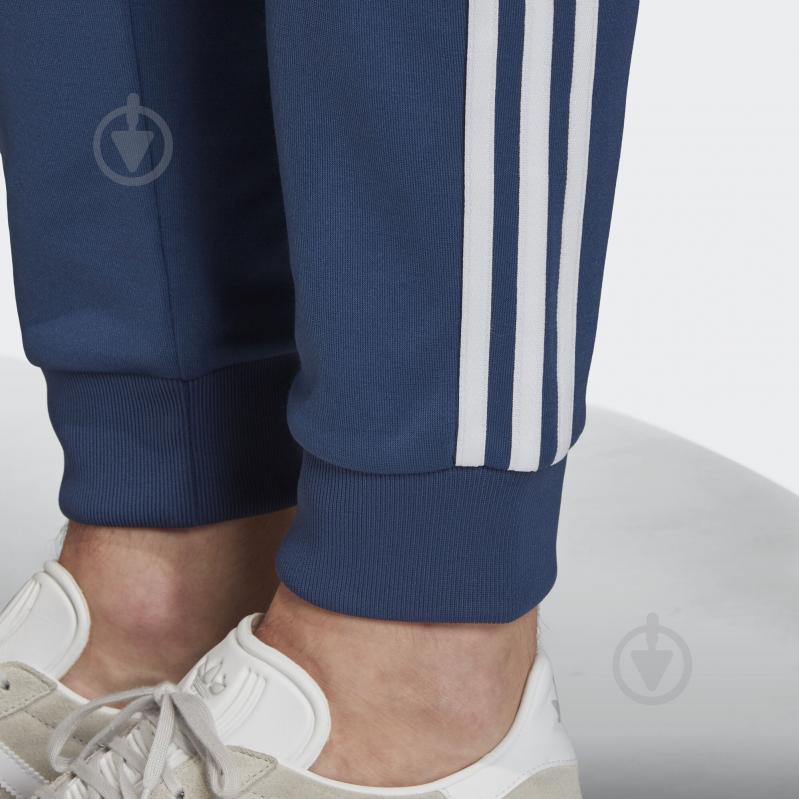 Брюки Adidas SST TP FM3807 р. M синий - фото 9