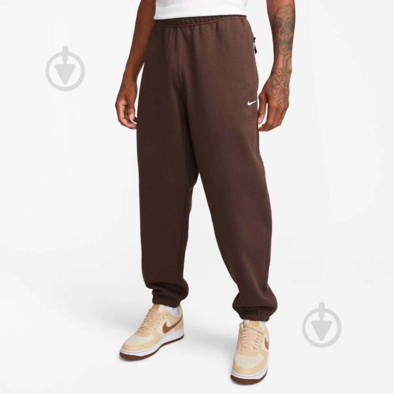 Штани Nike NK SOLO SWSH FLC CF PANT DX1364-237 р. S коричневий - фото 1