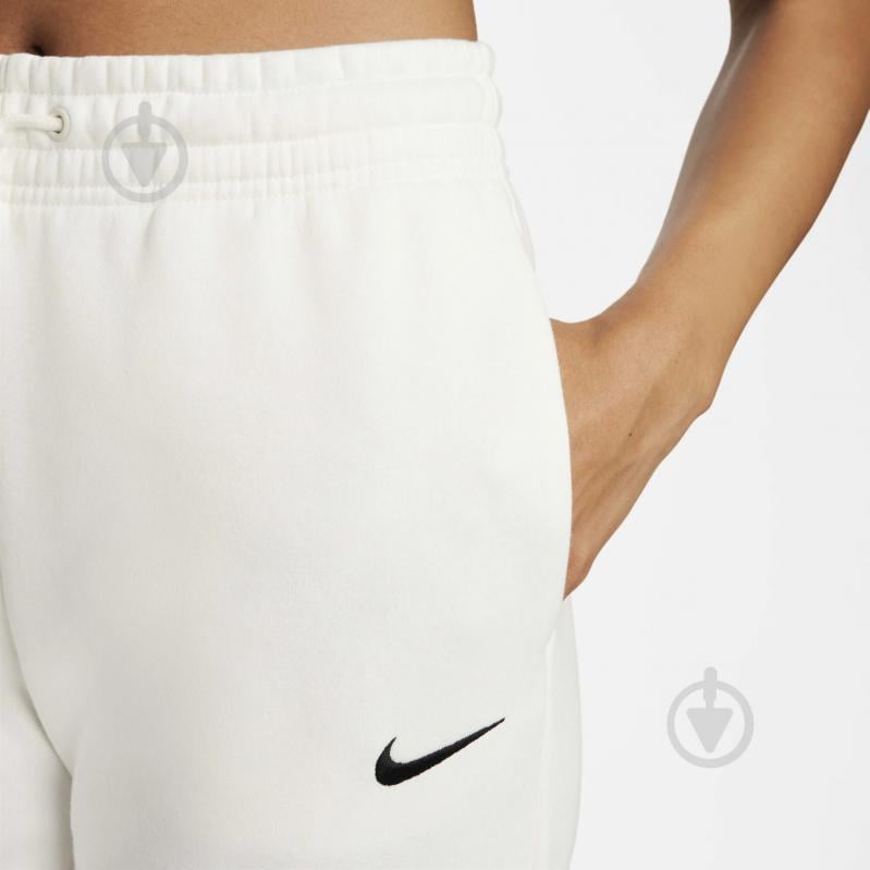 Штани Nike W NSW PHNX FLC MR PANT STD FZ7626-133 р. L бежевий - фото 4 Штани Nike W NSW PHNX FLC MR PANT STD FZ7626-133 р. L бежевий - фото 4