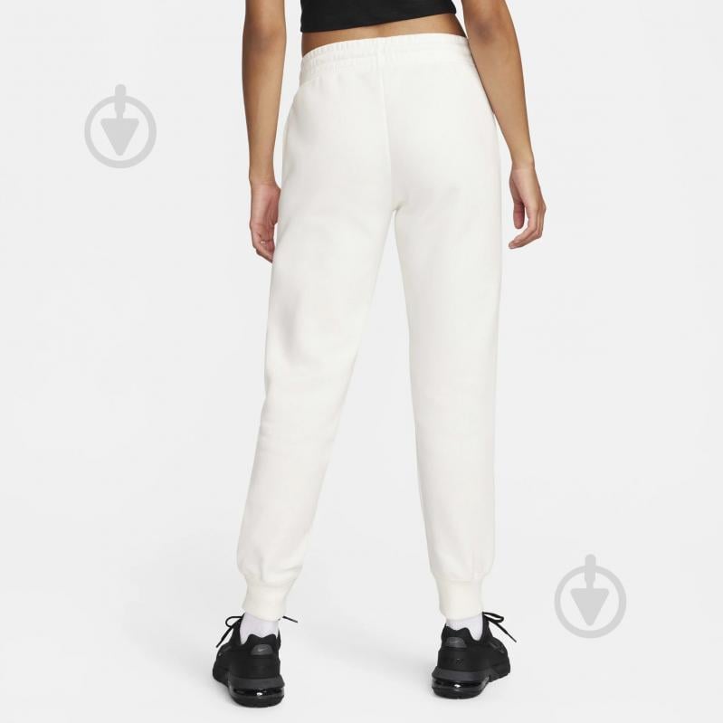 Брюки Nike W NSW PHNX FLC MR PANT STD FZ7626-133 р. XS бежевый - фото 2 Брюки Nike W NSW PHNX FLC MR PANT STD FZ7626-133 р. XS бежевый - фото 2