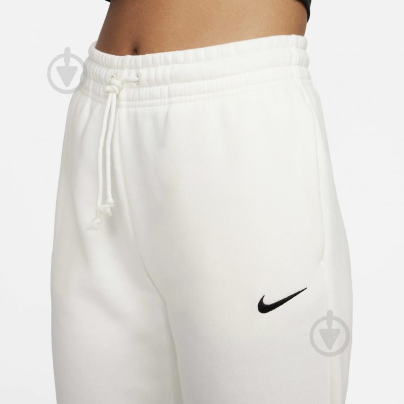 Брюки Nike W NSW PHNX FLC MR PANT STD FZ7626-133 р. XS бежевый - фото 3 Брюки Nike W NSW PHNX FLC MR PANT STD FZ7626-133 р. XS бежевый - фото 3