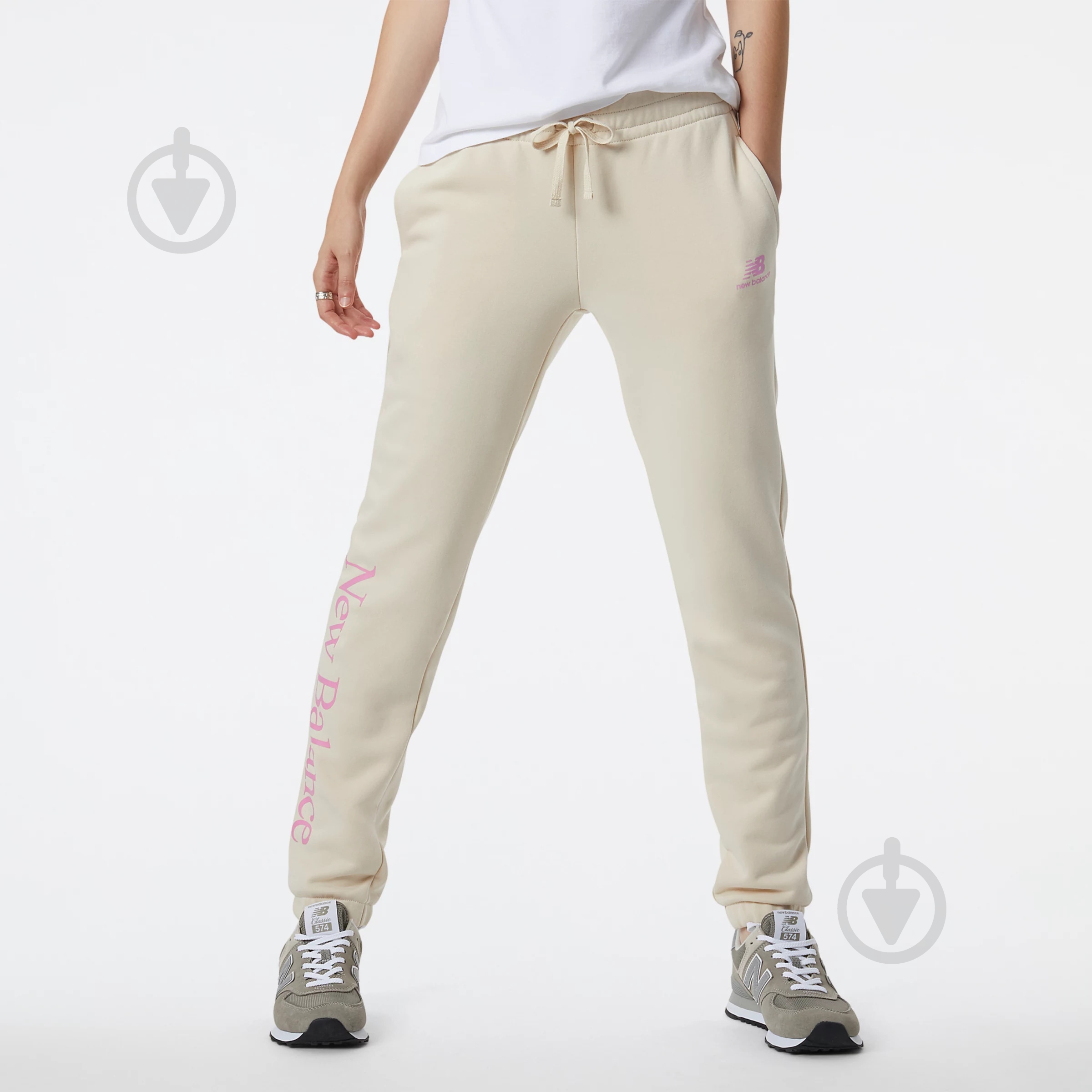 Брюки New Balance ESSENTIALS CELEBRATE WP21508CTU р. XS бежевый - фото 1