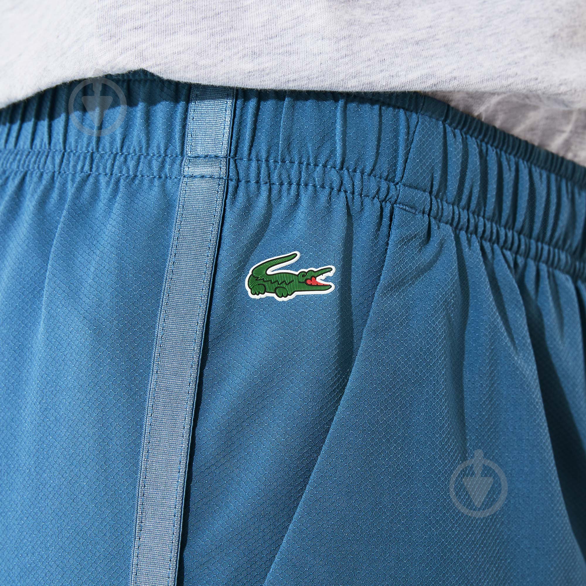 Брюки Lacoste XF3540A08 р. 42 синий - фото 4 Брюки Lacoste XF3540A08 р. 42 синий - фото 4