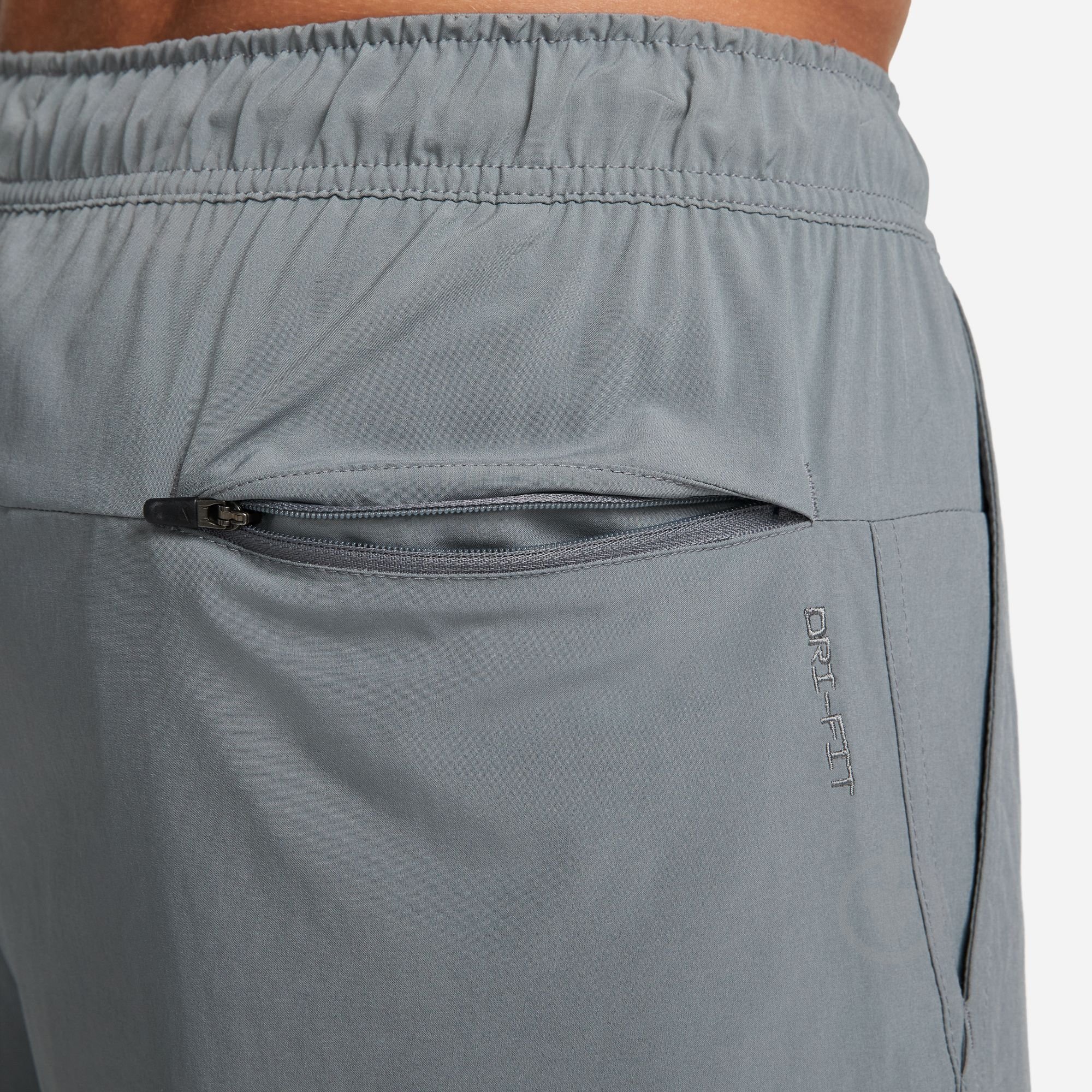 Шорти Nike M NK DF UNLIMITED WVN 7IN 2IN1 DV9334-084 р. M сірий - фото 5 Шорти Nike M NK DF UNLIMITED WVN 7IN 2IN1 DV9334-084 р. M сірий - фото 5