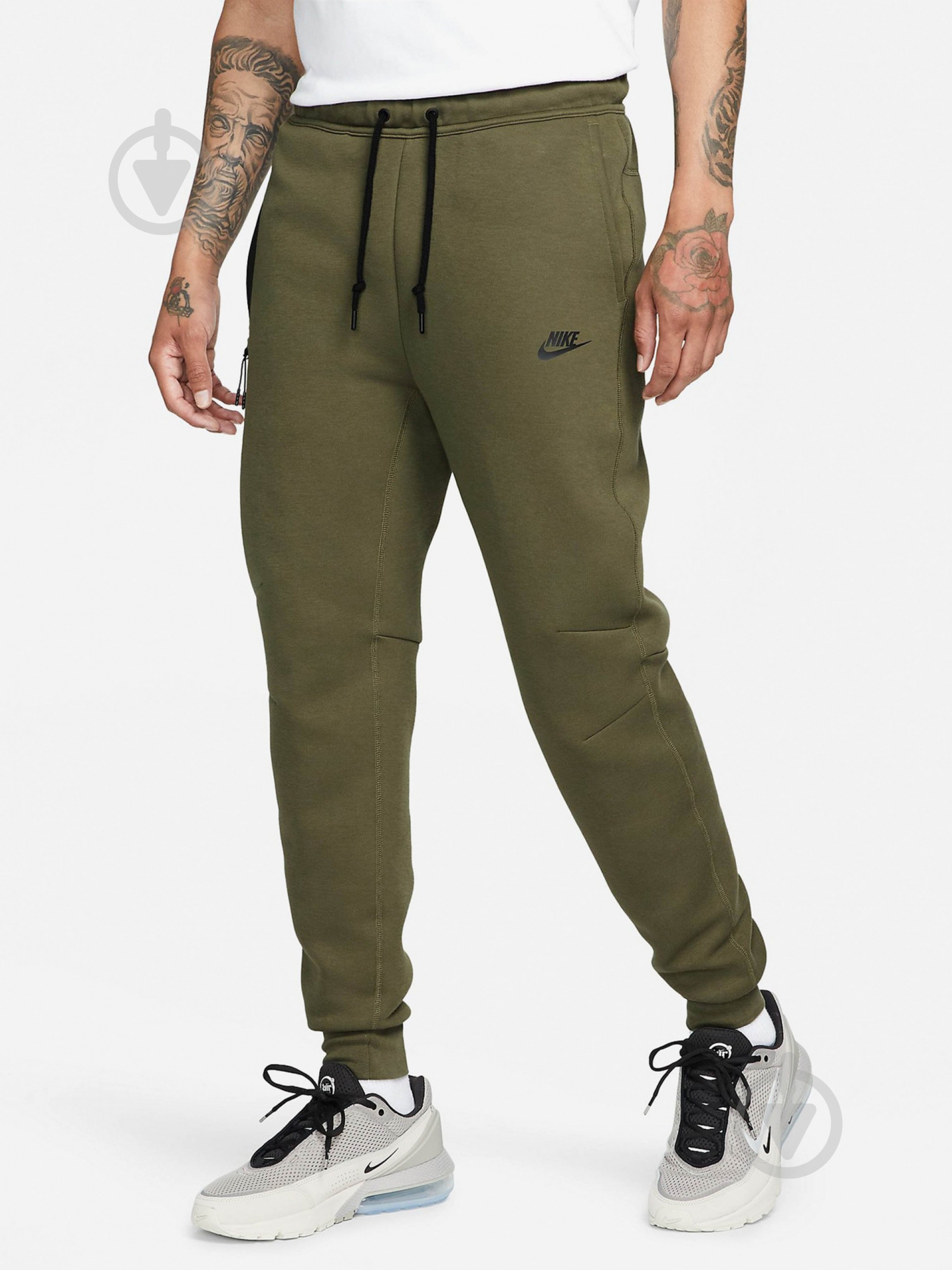 Брюки Nike M NK TCH FLC JGGR FB8002-222 р. M зеленый - фото 1