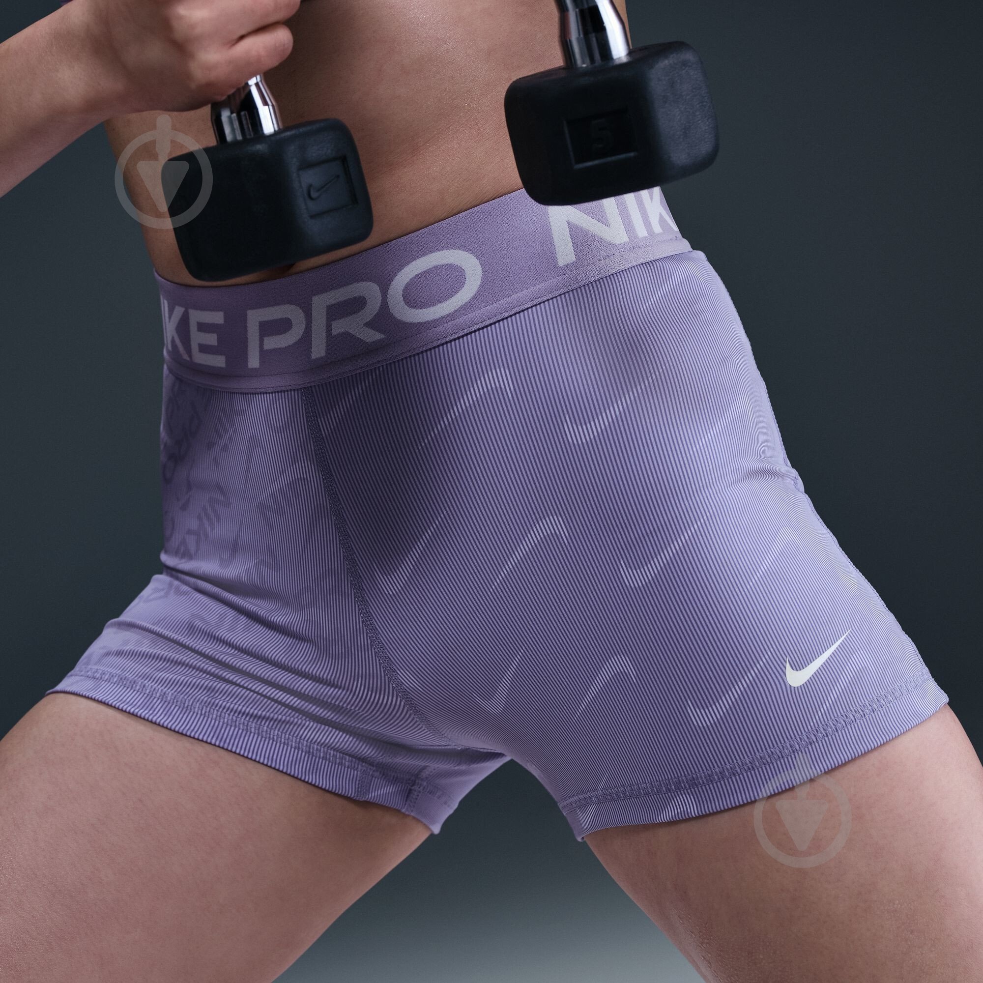 Лосини Nike W NP DF MR 3IN SHORT TT AOP HM6093-533 р.L фіолетовий - фото 9