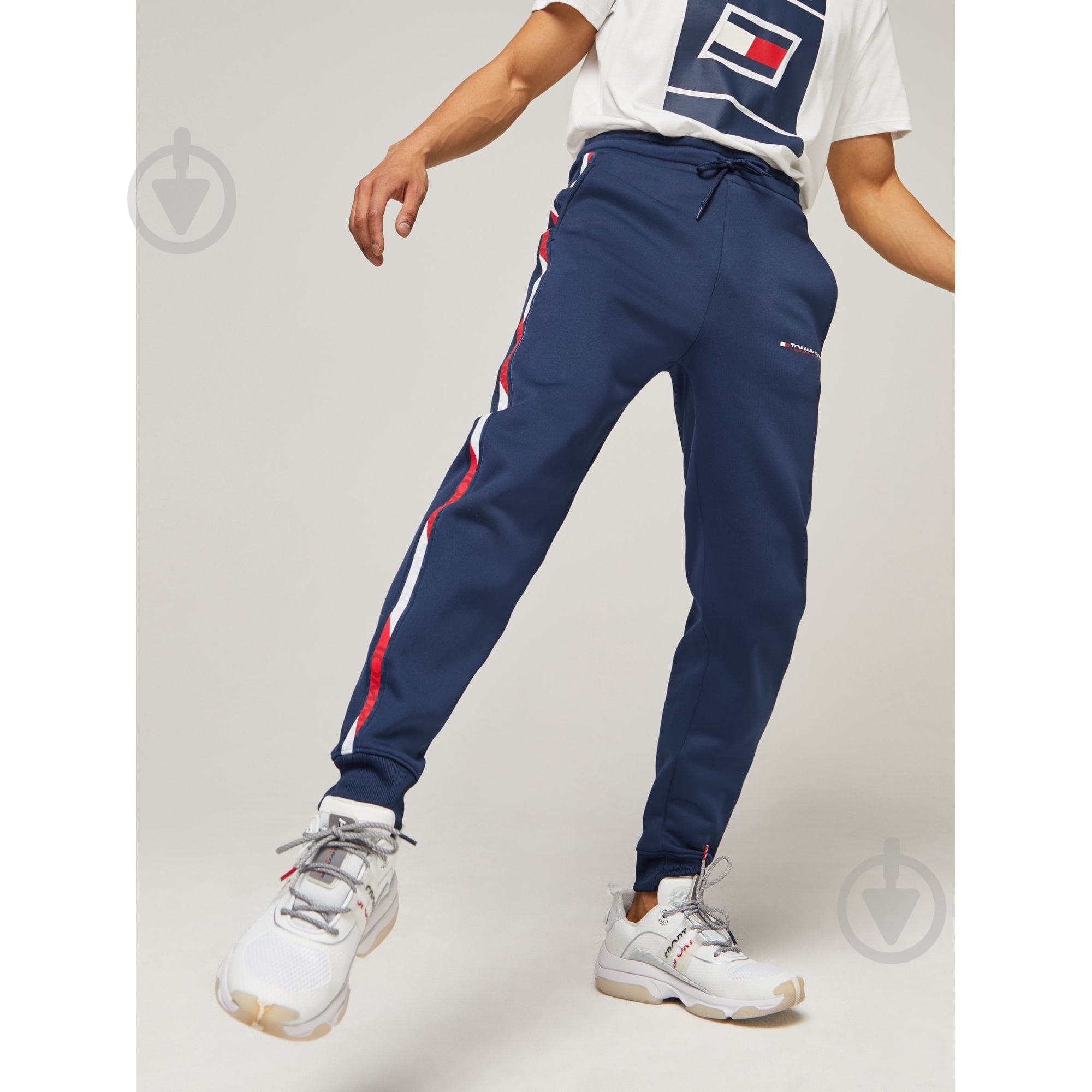Штани Tommy Hilfiger FLEECE TRACK PANT WITH TAPE S20S200294401 р. M темно-синій - фото 1