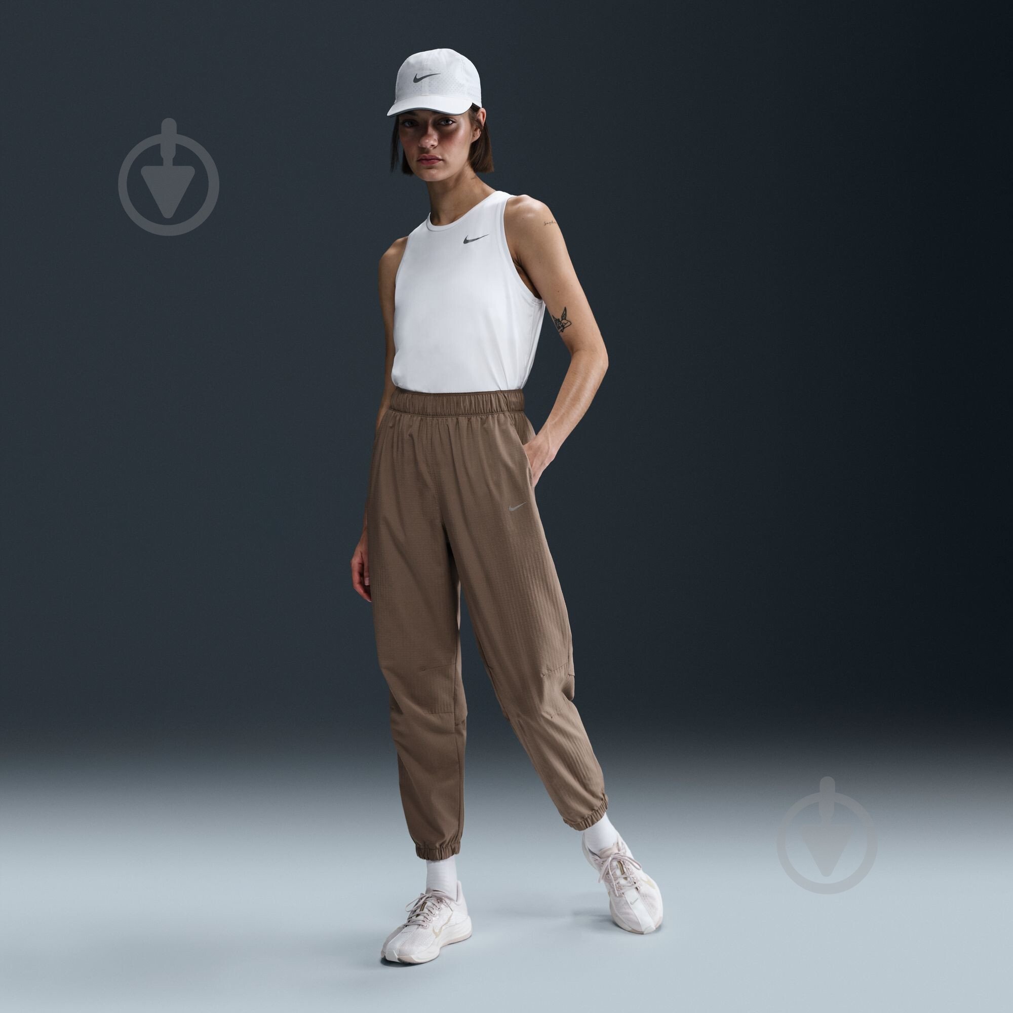 Штани Nike W NK FAST DF WRM MR 7/8 PNT FB7730-214 р. L коричневий - фото 8