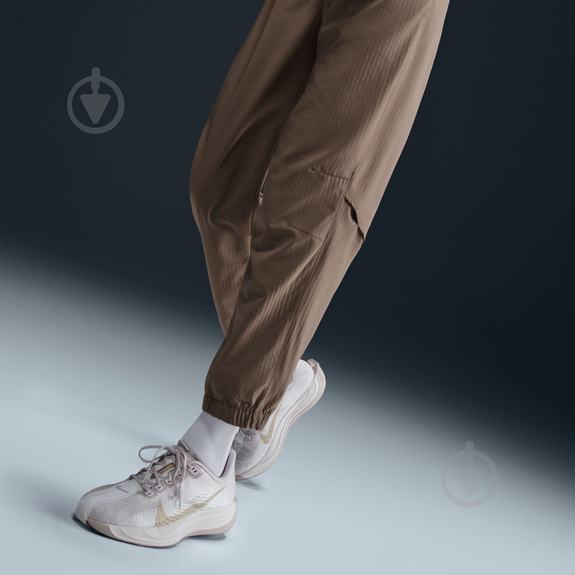 Штани Nike W NK FAST DF WRM MR 7/8 PNT FB7730-214 р. M коричневий - фото 10