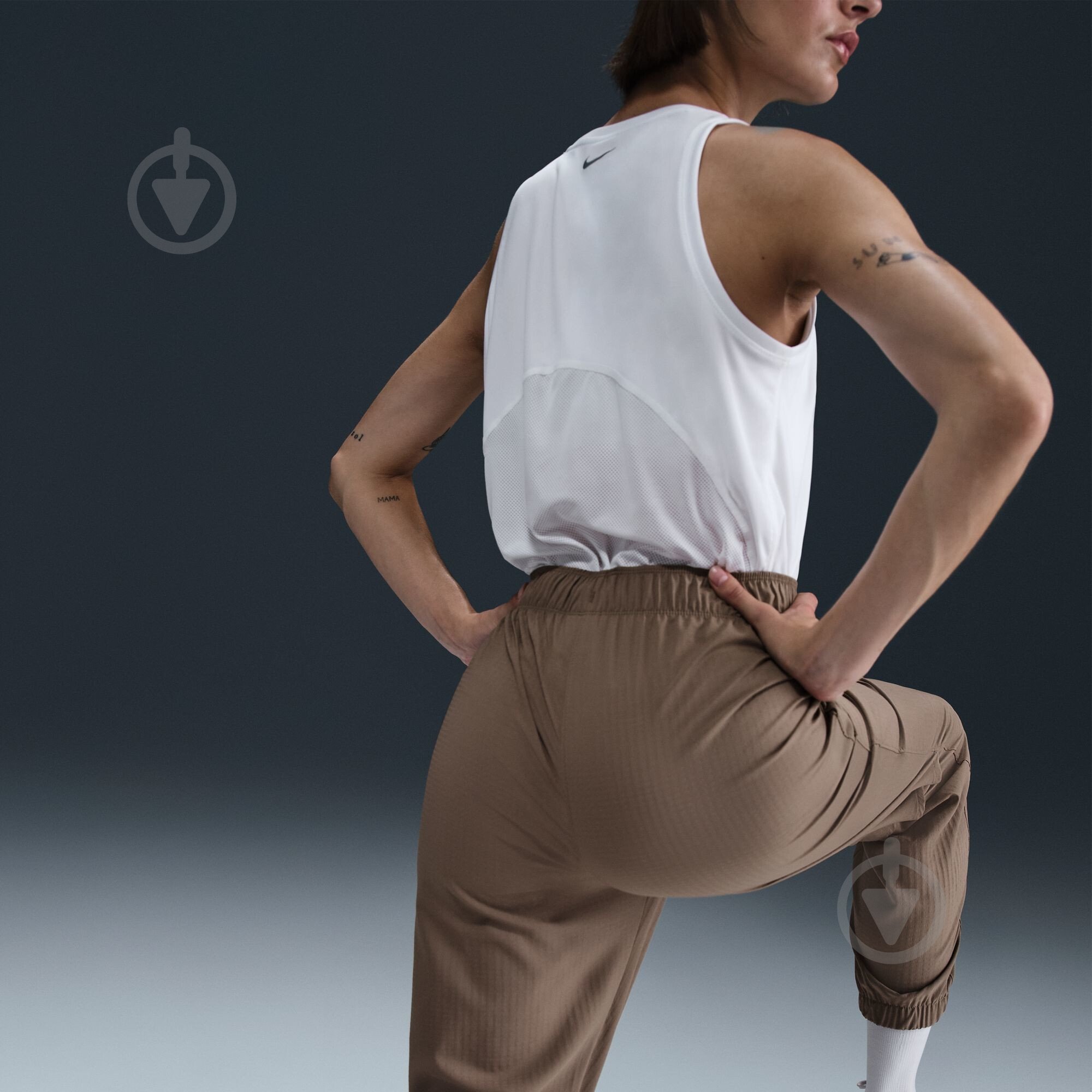 Штани Nike W NK FAST DF WRM MR 7/8 PNT FB7730-214 р. M коричневий - фото 11