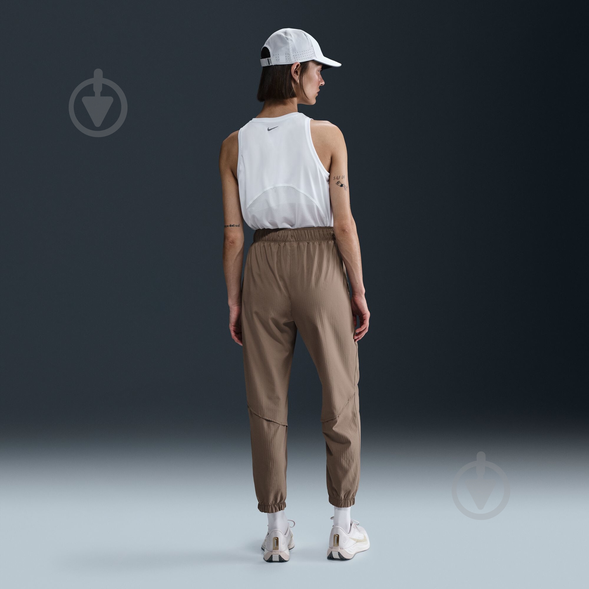 Штани Nike W NK FAST DF WRM MR 7/8 PNT FB7730-214 р. XL коричневий - фото 7