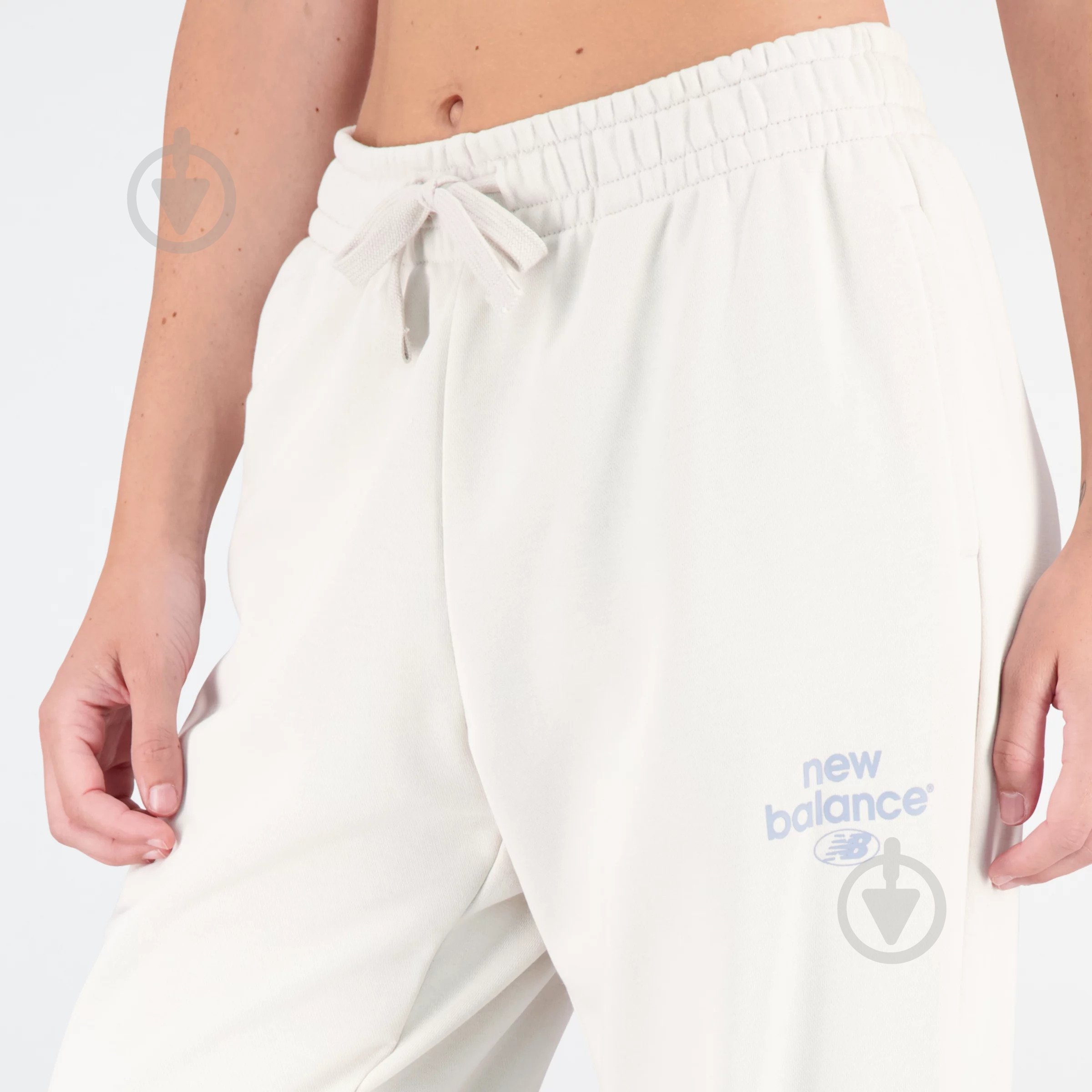 Штани New Balance ESSENTIALS REIMAGINED ARCH WP31508MBM р. L бежевий - фото 5