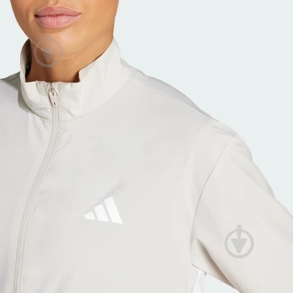 Вітрівка жіноча Adidas WE 3S WOVEN JKT WONALU/WHITE JE6173 р.M бежева - фото 4 Вітрівка жіноча Adidas WE 3S WOVEN JKT WONALU/WHITE JE6173 р.M бежева - фото 4