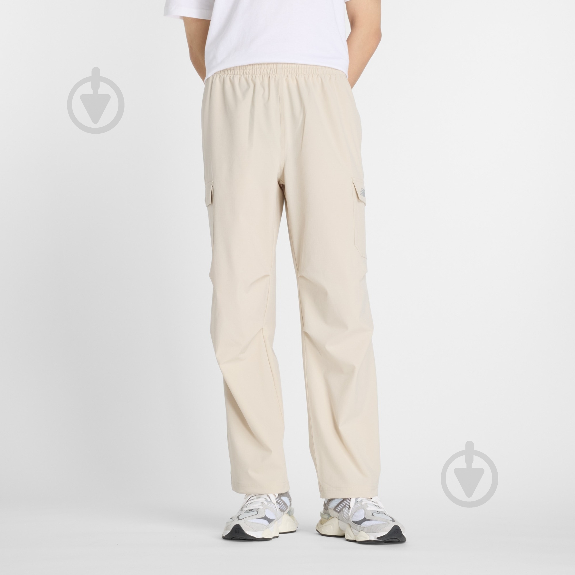 Брюки New Balance MP51538TWF р. XL бежевый - фото 1