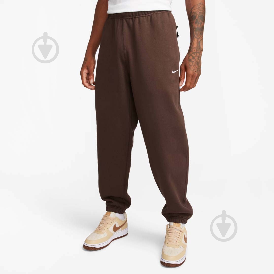 Штани Nike NK SOLO SWSH FLC CF PANT DX1364-237 р. S коричневий - фото 1