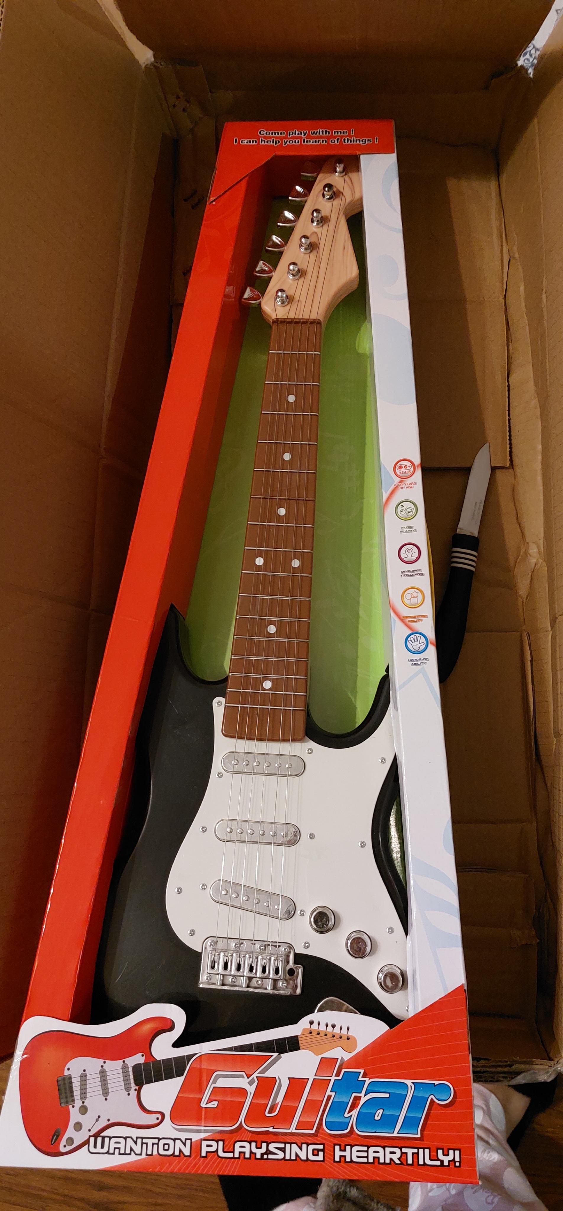 Гитара Qunxing Toys 8810 в реальных условиях использования от покупателя Ілона.