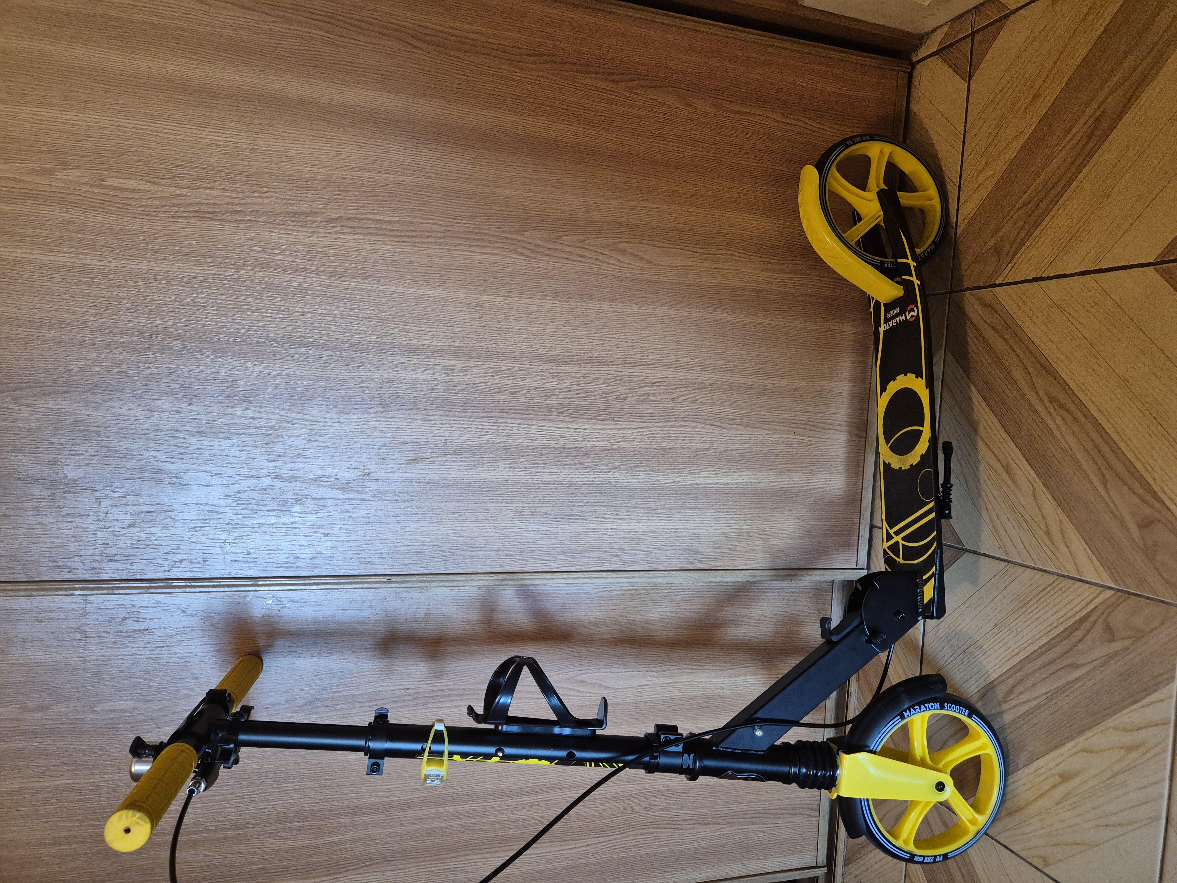 Самокат двухколесный Maraton Rider с ручным тормозом и амортизатором + LED фонарик Фиолетовый в реальных условиях использования от покупателя Анна.