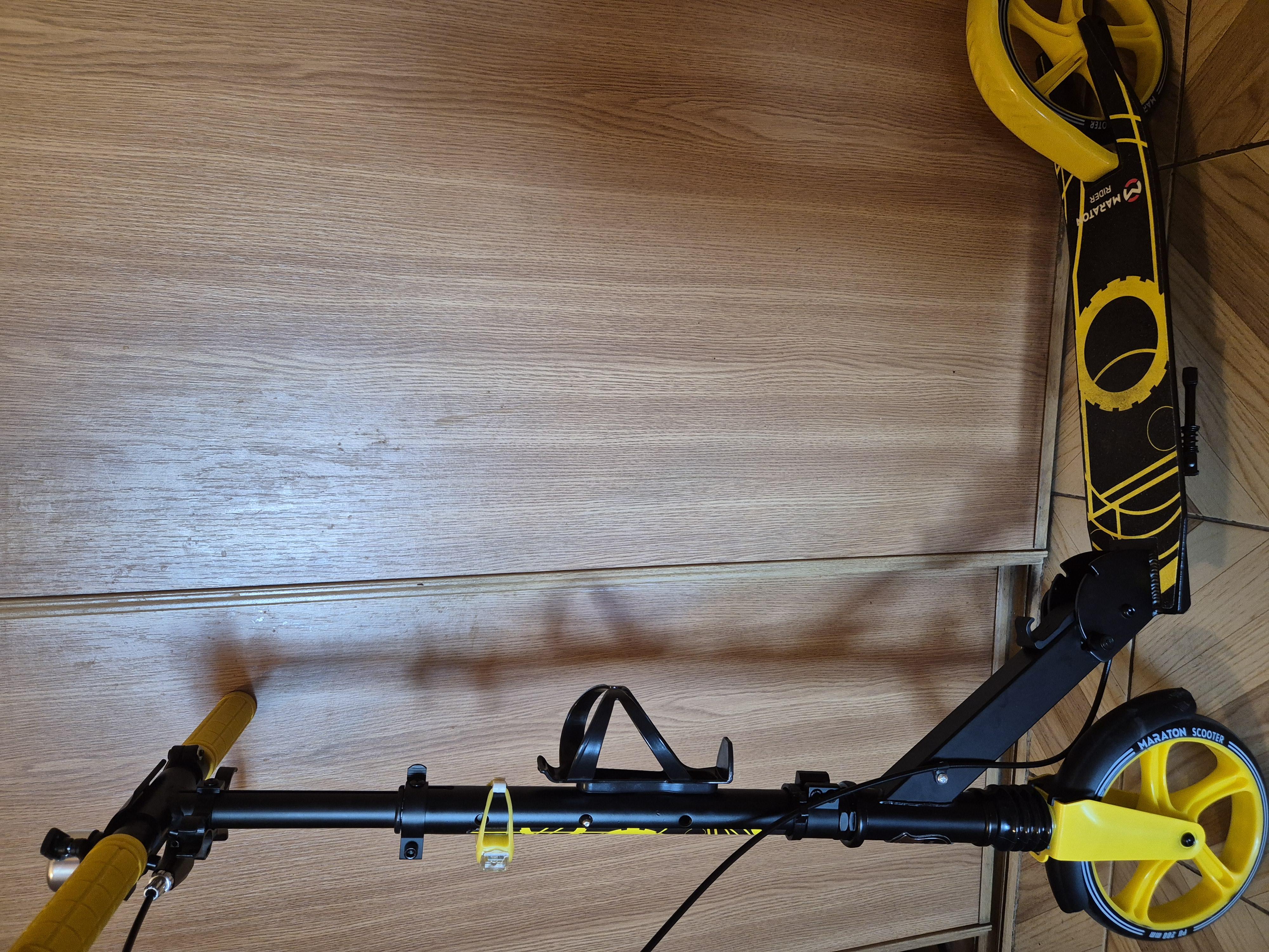 Самокат двухколесный Maraton Rider с ручным тормозом и амортизатором + LED фонарик Фиолетовый в реальных условиях использования от покупателя Анна.