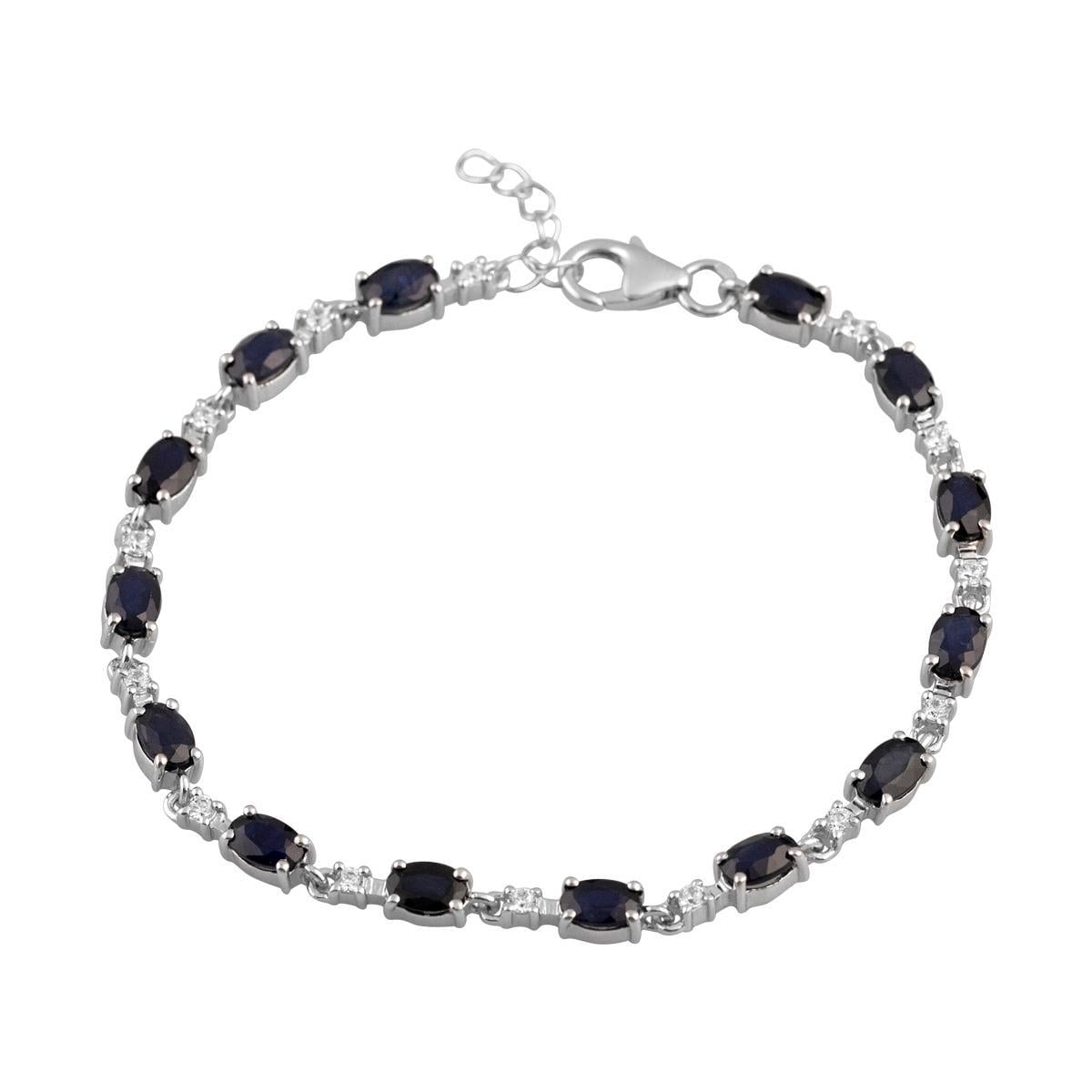 Браслет серебрянный с натуральным сапфиром темно-синего цвета овальной формы и вставками прозрачных фианитов р. 17-20 см