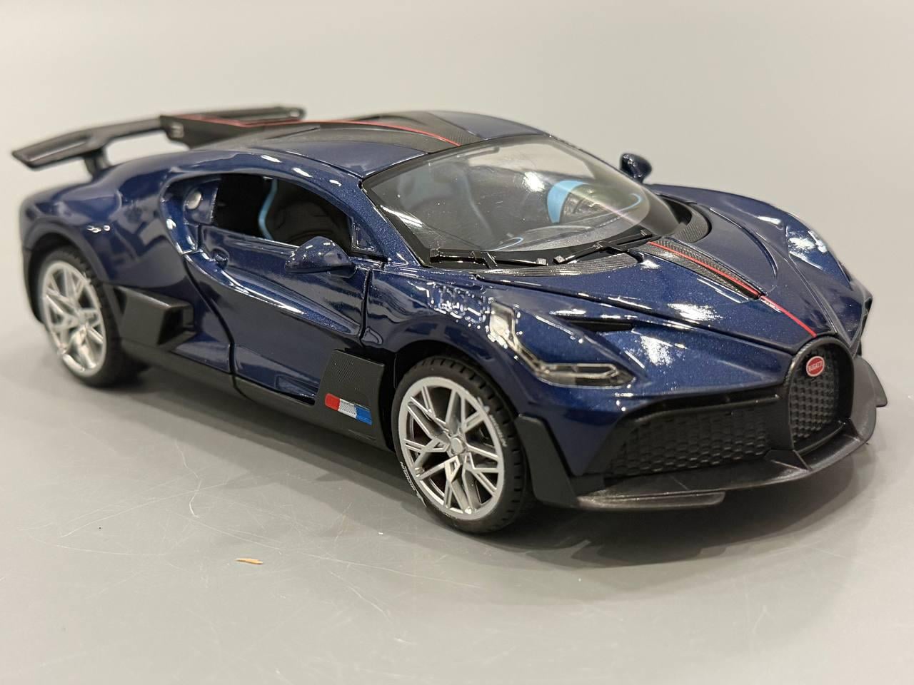 Машина АвтоСвіт Bugatti інерційна відкриваються двері/капот/звук/світло масштаб 1:22 20,5см Синій (AP-1978) Машина АвтоСвіт Bugatti інерційна відкриваються двері/капот/звук/світло масштаб 1:22 20,5см Синій (AP-1978)