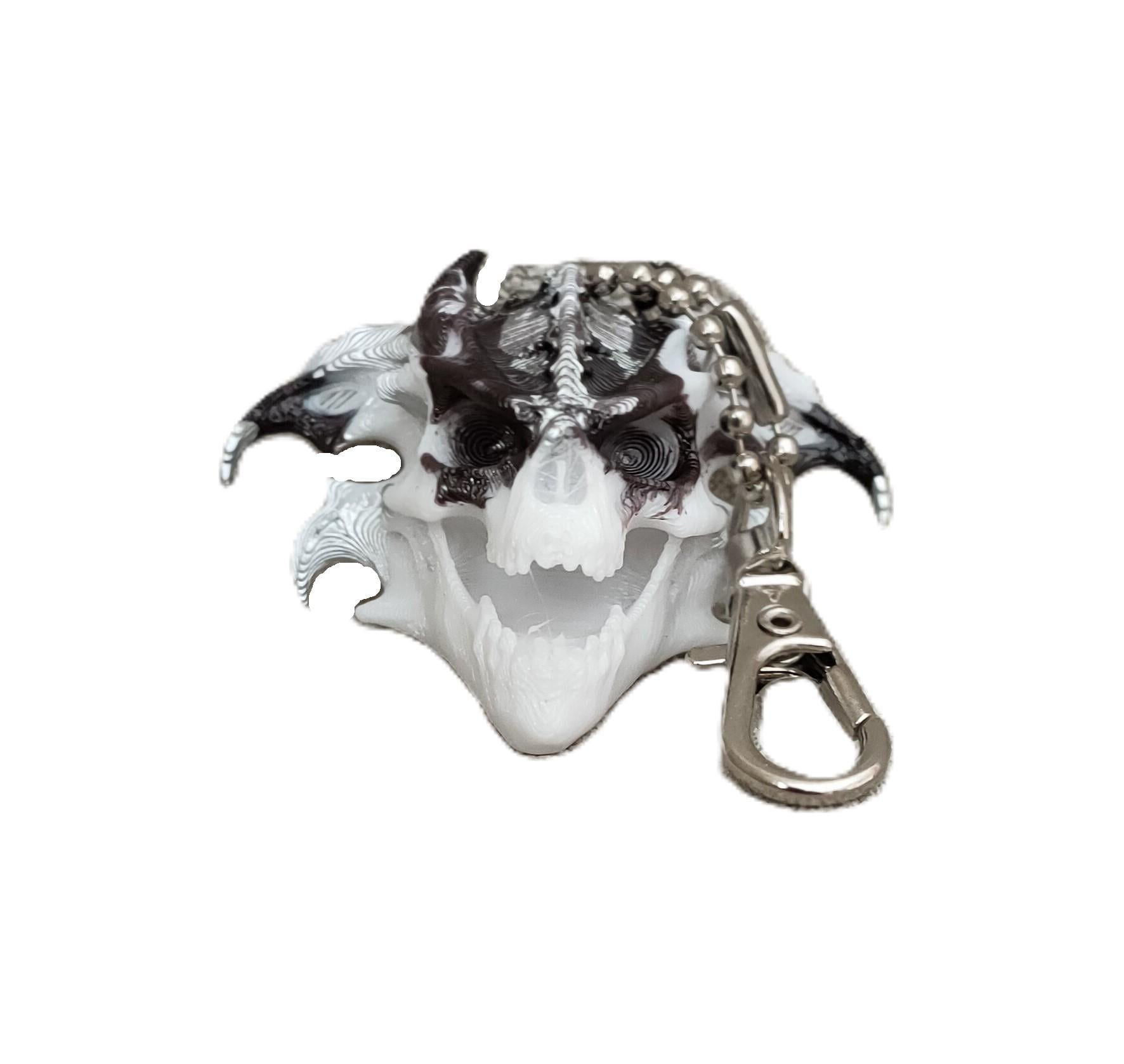 Брелок череп Дракона 50х40х20 мм Біло-коричневий/сріблястий (CDК-05G-BKS) Брелок череп Дракона 50х40х20 мм Біло-коричневий/сріблястий (CDК-05G-BKS)