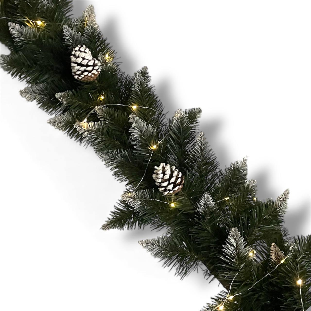 Хвойная гирлянда ПВХ заснеженная с шишкой и Led подсветкой 2 м (YA1000)