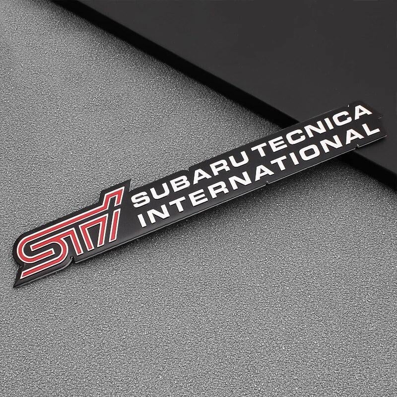 Эмблема алюминиевая SUBARU STI Subaru tecnica international 16х2,8 см (1709153358)
