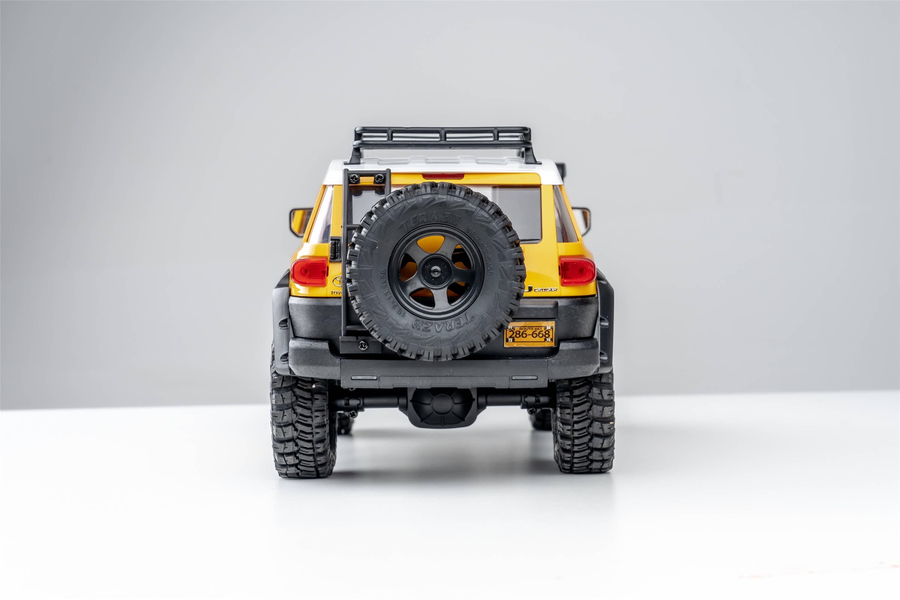 Машинка на радиоуправлении FMS 1:18 FJ Cruiser RTR Yellow - фото 25 Машинка на радиоуправлении FMS 1:18 FJ Cruiser RTR Yellow - фото 25